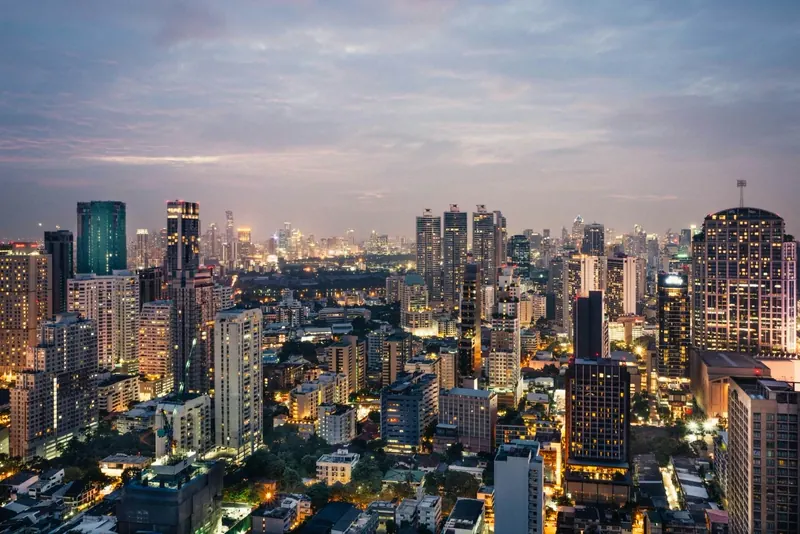 Bangkok’s skyline lit up at dusk